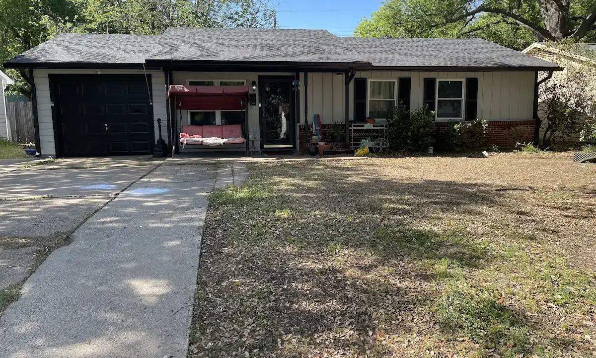 Asphalt Shingle Roof Repair crew at work on a residential roof in Porters Neck